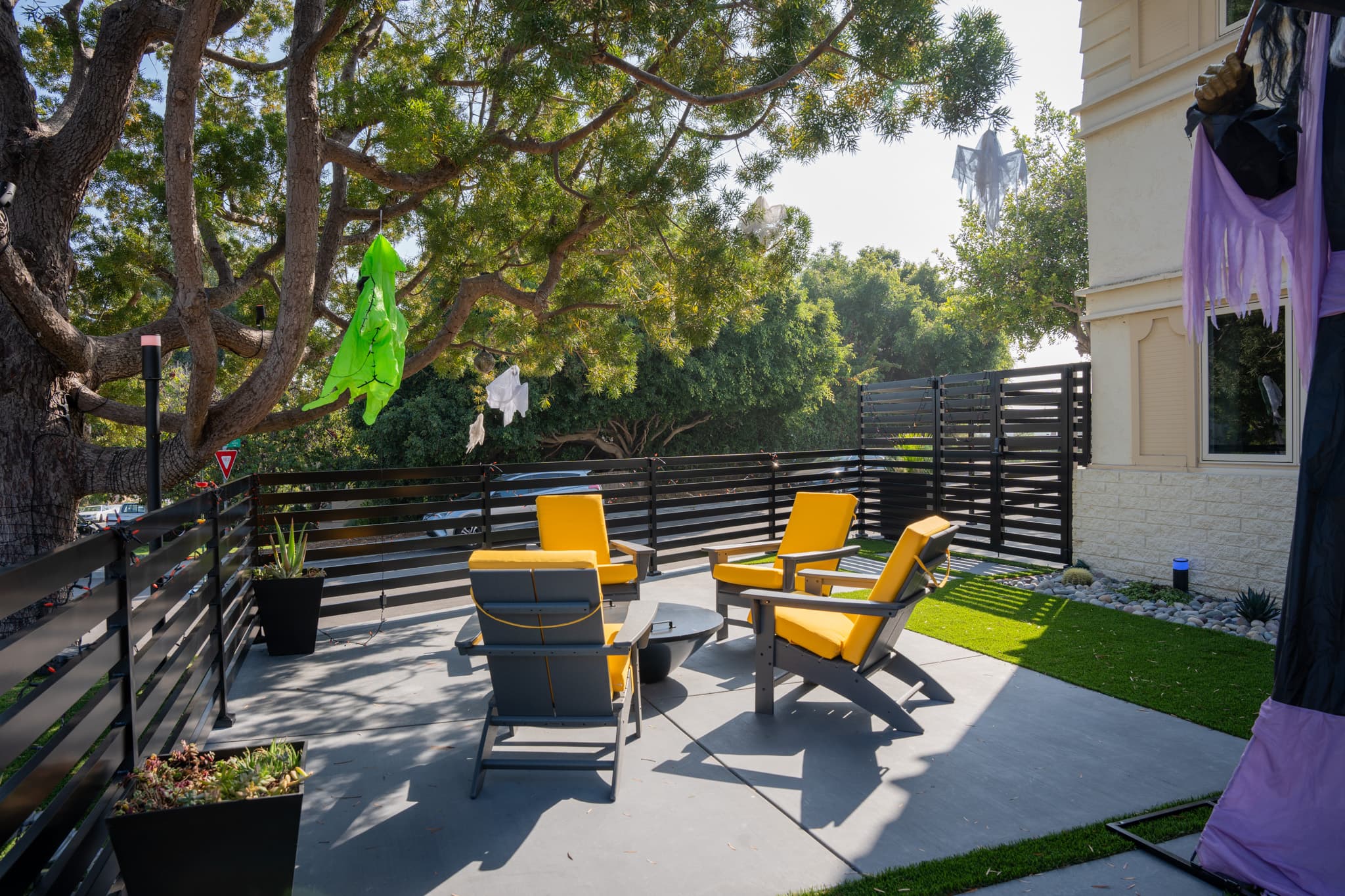 Spacious outdoor living area featuring a built-in kitchen and contemporary seating.